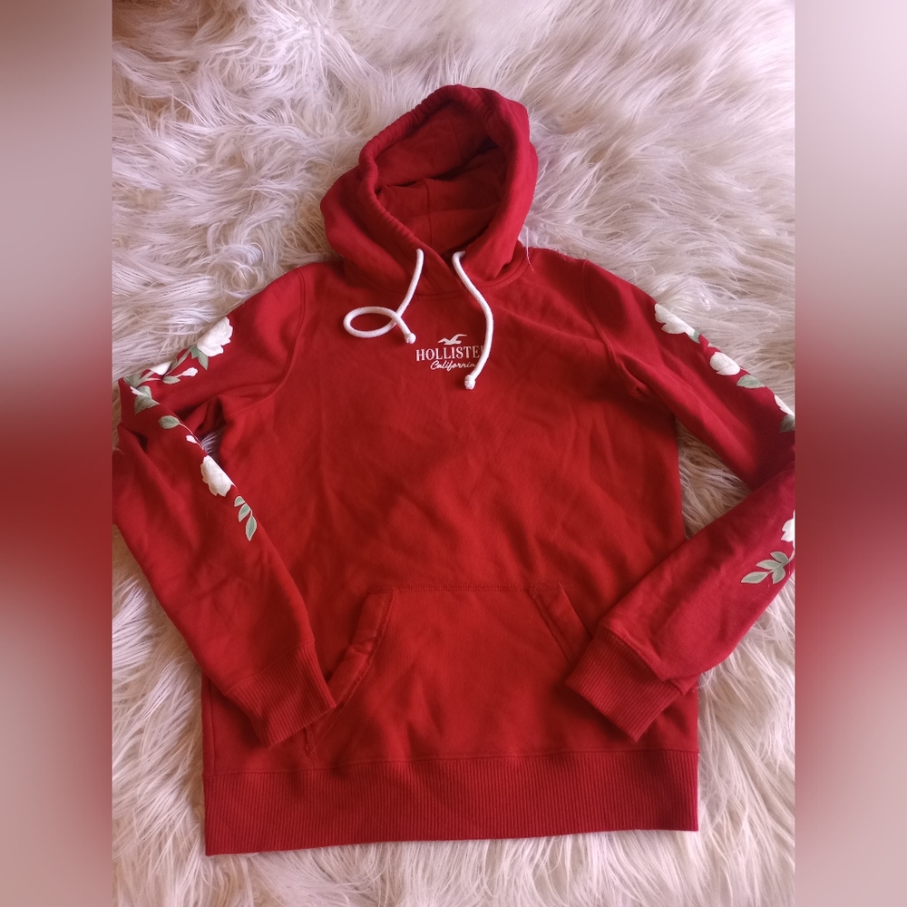 Red Hollister hoodie with flowers down sleeves